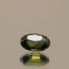 Green sapphire gemstone 1.25 carat oval cut, untreated, Madagascar origin, dimensions 7.31 × 5.18 × 3.83 mm, GFCO certified.