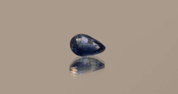 Blue pear-shaped sapphire, 0.83 carat, 6.88 × 4.83 × 3.04 mm, heat-treated, unknown origin, AIG certified.
