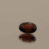 Vivid red spinel, oval cut, 1.5 carat, 8.05 × 5.64 × 4.08 mm, natural untreated gemstone from Burma, AIG certified.