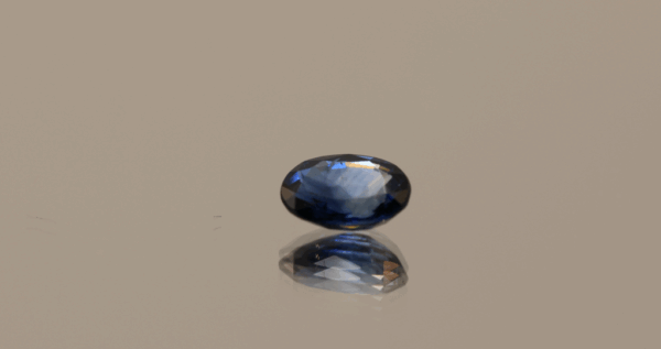 Natural sapphire gemstone, 0.83 carat, oval cut, royal blue color, heat-treated, loose gemstone, dimensions 6.68 × 4.81 × 2.85 mm, origin Madagascar, IGS certified.