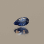 Blue pear-shaped sapphire, heat treated, unknown origin, 0.9 carat, dimensions 6.77 × 5.07 × 3.21 mm, AIG certified.