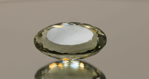 Natural prasiolite gemstone, 20.91 carat, oval cut, pale green color, untreated, loose gemstone, dimensions 23.6 × 14 × 9.2 mm, ideal for fine jewelry.
