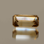 Light brown octagon-shaped topaz, 7.7 carat, 10 × 7.5 × 6.9 mm, no treatment, unknown origin.