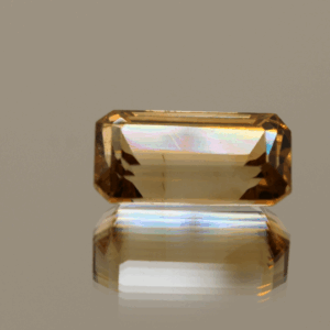 Light brown octagon-shaped topaz, 7.7 carat, 10 × 7.5 × 6.9 mm, no treatment, unknown origin.