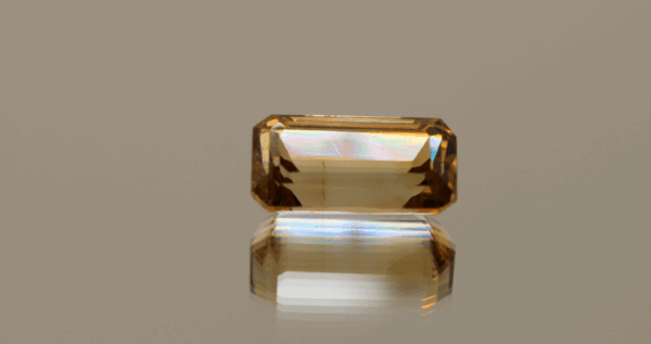 Light brown octagon-shaped topaz, 7.7 carat, 10 × 7.5 × 6.9 mm, no treatment, unknown origin.