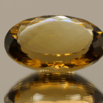 Brownish yellow oval-shaped smoky quartz, 23.97 carat, 24.4 × 16.8 × 10.0 mm, no treatment, unknown origin.