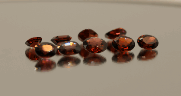 Natural almandine garnet gemstones 13.6 carats mixed cuts purple red color untreated loose stones set