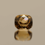 Light brown cushion-shaped topaz, 4.73 carat, 9.6 × 8.3 × 6.6 mm, no treatment, unknown origin.