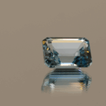 Blue octagon-shaped topaz, 5.6 carat, 11 × 8.9 × 5.6 mm, no treatment, unknown origin.