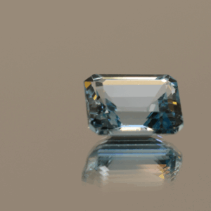 Blue octagon-shaped topaz, 5.6 carat, 11 × 8.9 × 5.6 mm, no treatment, unknown origin.