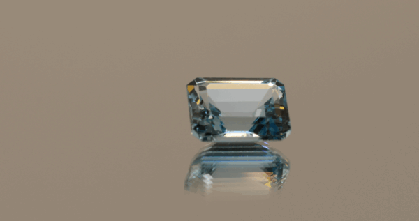 Blue octagon-shaped topaz, 5.6 carat, 11 × 8.9 × 5.6 mm, no treatment, unknown origin.