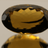 Brownish yellow oval-shaped smoky quartz, 37.8 carat, 26.2 × 17.1 × 14.1 mm, no treatment, unknown origin.