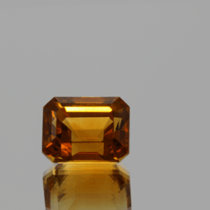 Natural octagon cut citrine gemstone with yellow-orange color, 10.4 × 8 mm