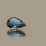 Blue pear-shaped sapphire, 0.77 carat, 7.16 × 4.86 × 2.70 mm, heat-treated, unknown origin, AIG certified.