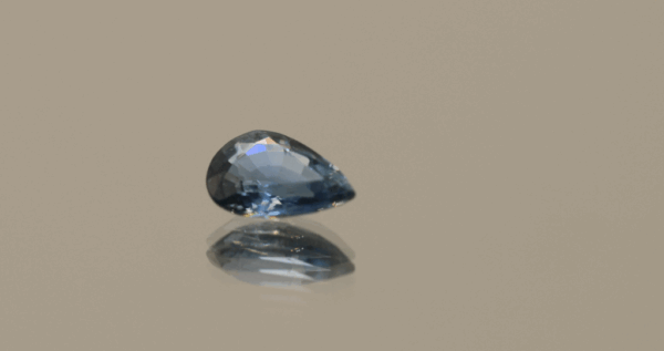 Blue pear-shaped sapphire, 0.77 carat, 7.16 × 4.86 × 2.70 mm, heat-treated, unknown origin, AIG certified.