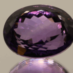 Natural oval cut amethyst gemstone with purple violet color, 22.10 × 16.80 mm