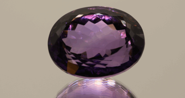 Natural oval cut amethyst gemstone with purple violet color, 22.10 × 16.80 mm