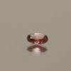 Natural Padparadscha Oval sapphire gemstone, 0.54 carat, oval cut, orange pink color, unheated, loose gemstone, dimensions 5.84 × 5.03 × 2.09 mm, origin Madagascar, AIG certified.
