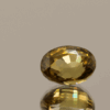 Yellow oval-shaped zircon, 4.17 carat, 9.71 × 7.41 × 5.49 mm, heat-treated, unknown origin, IGI certified (M3A38186).