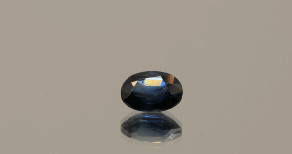 Royal blue color sapphire gemstone, 0.99 carat, oval cut, heat-treated, loose gemstone, dimensions 6.8 × 5.13 × 3.24 mm, origin Madagascar, IGS certified.