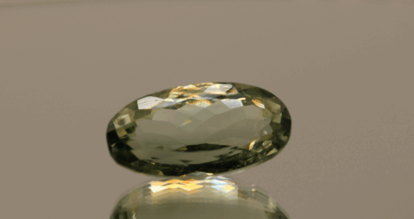 Natural prasiolite gemstone, 14.8 carat, oval cut, pale green color, untreated, loose gemstone, dimensions 21.2 × 11 × 9.6 mm, ideal for fine jewelry.