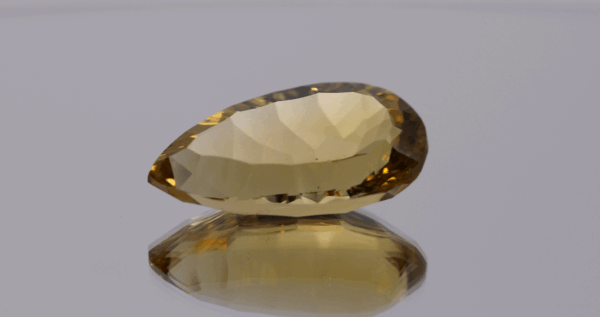 Natural pear cut citrine gemstone with yellow-orange color, 23.30 × 12.30 mm