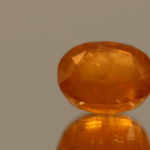 Natural Hackmanite gemstone, 6.71 ct, orange oval, untreated, certified AIG GEM20231110104162