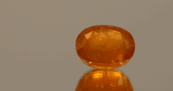 Natural Hackmanite gemstone, 6.71 ct, orange oval, untreated, certified AIG GEM20231110104162