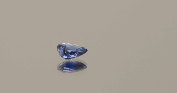 Blue pear-shaped sapphire, heat treated, unknown origin, 0.79 carat, dimensions 6.7 × 6.06 × 2.33 mm, AIG certified.