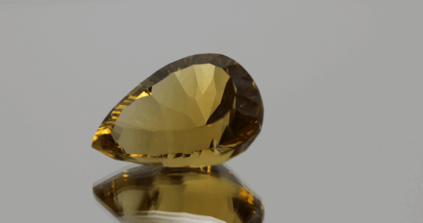 Natural pear cut citrine gemstone with yellow-orange color, 20.10 × 14.20 mm