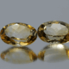Natural oval cut citrine gemstone with yellow-orange color, 14.22 × 10.17 mm