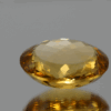 Natural oval cut citrine gemstone with yellow-orange color, 19.60 × 16.60 mm