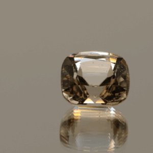 Light brown cushion-shaped topaz, 6.3 carat, 11.3 × 9.6 × 7.5 mm, no treatment, unknown origin.