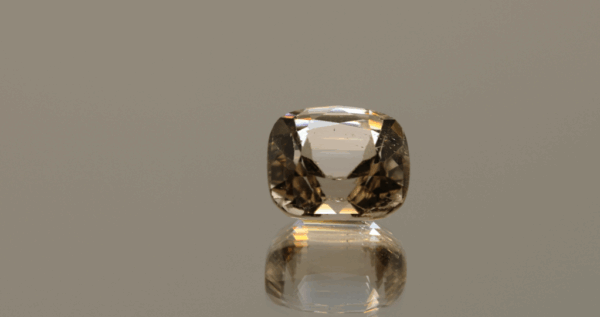 Light brown cushion-shaped topaz, 6.3 carat, 11.3 × 9.6 × 7.5 mm, no treatment, unknown origin.