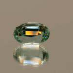 Light green cushion-shaped spodumene, 6.45 carat, 12.5 × 8.1 × 8.5 mm, no treatment, unknown origin.