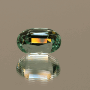 Light green cushion-shaped spodumene, 6.45 carat, 12.5 × 8.1 × 8.5 mm, no treatment, unknown origin.