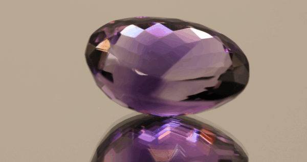 Natural oval cut amethyst gemstone with purple violet color, 20.70 × 14.00 mm