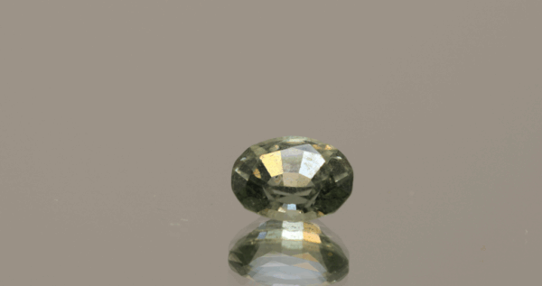 Yellow green sapphire gemstone 1.37 carat oval cut, heat treated, loose gemstone, dimensions 7.18 × 5.74 × 4.06 mm, ALGT certified.