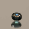 Blue sapphire gemstone 1.28 carat oval cut, heat treated, Madagascar origin, dimensions 6.27 × 5.54 × 3.89 mm, GFCO certified.