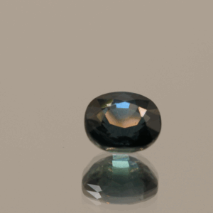 Blue sapphire gemstone 1.28 carat oval cut, heat treated, Madagascar origin, dimensions 6.27 × 5.54 × 3.89 mm, GFCO certified.