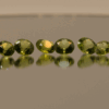 Set of 16 natural peridot gemstones, round cut, yellowish green color, untreated, total weight 13.73 carat, dimensions 6.8 × 5.1 × 3–3.9 mm, ideal for fine jewelry.