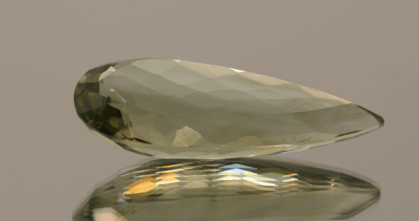 Natural prasiolite gemstone, 22.87 carat, pear cut, pale green color, untreated, loose gemstone, dimensions 32.9 × 13.8 × 8.6 mm, ideal for fine jewelry.