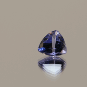 Violet triangular-shaped tanzanite, 0.84 carat, 6.37 × 6.72 × 3.62 mm, no treatment, unknown origin, GIA certified.