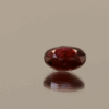 Natural ruby red gemstone, 2.02 carat, oval cut, vivid deep red color, minor oil treatment, loose gemstone, dimensions 8.51 × 6.64 × 4.01 mm, origin Thailand (Siam), IGE certified.