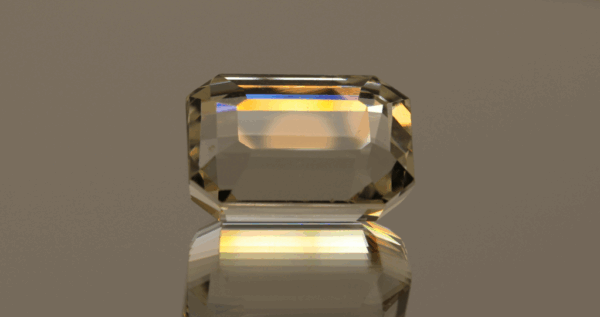 Light yellow octagon-shaped spodumene, 21.55 carat, 17.6 × 12 × 10.7 mm, no treatment, unknown origin.