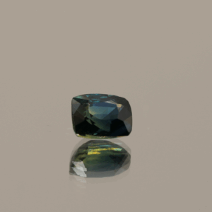 Natural sapphire gemstone, 0.89 carat, cushion cut, greenish blue color, unheated, loose gemstone, dimensions 5.63 × 4.74 × 3.43 mm, origin Madagascar, GFCO certified.