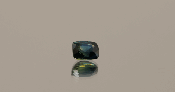 Natural sapphire gemstone, 0.89 carat, cushion cut, greenish blue color, unheated, loose gemstone, dimensions 5.63 × 4.74 × 3.43 mm, origin Madagascar, GFCO certified.