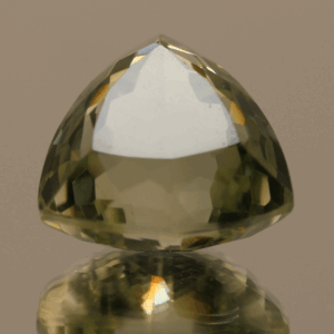 Natural prasiolite gemstone, 21 carat, trillion cut, pale green color, untreated, loose gemstone, dimensions 16.9 × 16.6 × 12.7 mm, ideal for fine jewelry.