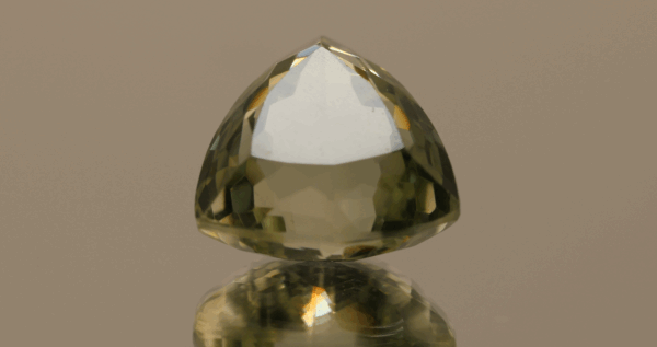 Natural prasiolite gemstone, 21 carat, trillion cut, pale green color, untreated, loose gemstone, dimensions 16.9 × 16.6 × 12.7 mm, ideal for fine jewelry.