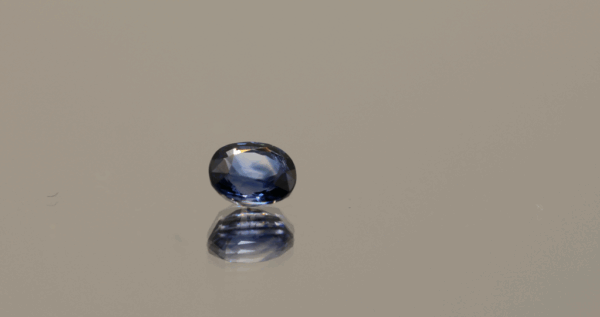 Natural Unheated Sapphire blue gemstone, 0.77 carat, oval cut, blue color, untreated, loose gemstone, dimensions 5.38 × 4.71 × 3.16 mm, origin Madagascar, AIG certified.